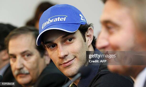 Brazilian Bruno Senna listens to Adrian Campos, Manager of the Campos Meta Formula One team, during a press conference for his official presentation...