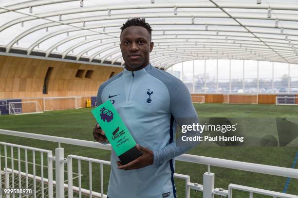 Victor Wanyama of Tottenham Hotspur poses with the trophy for Carling Premier League Goal of the Month for February 2018 at on March 8, 2018 in...