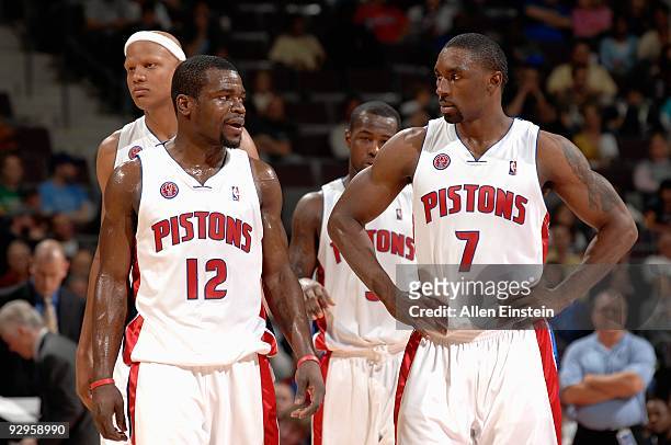 Charlie Villanueva, Will Bynum, Rodney Stuckey and Ben Gordon of the Detroit Pistons stand on the court during the game against the Philadelphia...