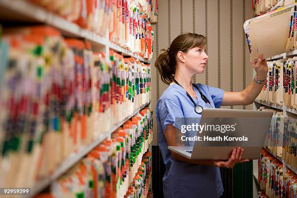 medical records new and old. - healthcare paperwork stock pictures, royalty-free photos & images