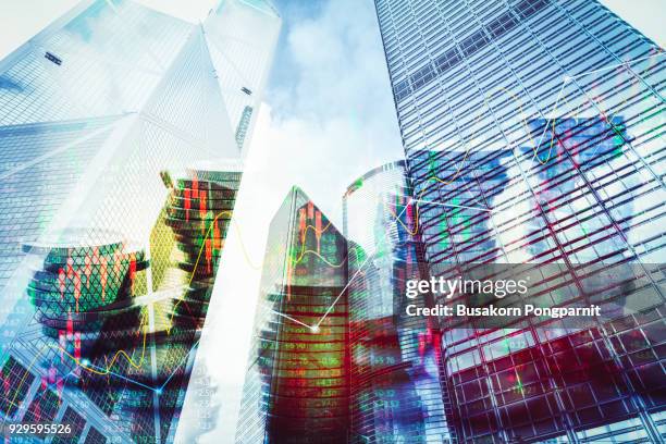 double exposure image of coin on city with technology financial graph background. - consumerism china stock pictures, royalty-free photos & images