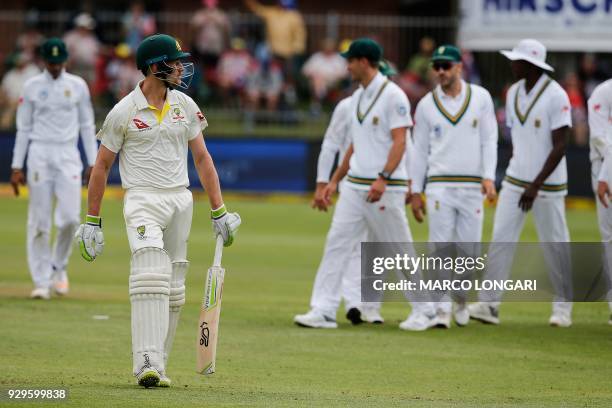 Australia batsman Cameron Bancroft leaves the ground after having been dismissed by South Africa bowler Vernon Philander during day one of the second...