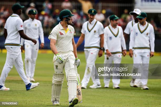 Australia batsman Cameron Bancroft leaves the ground after having been dismissed by South Africa bowler Vernon Philander during day one of the second...