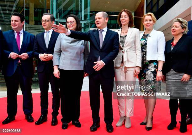 Social Democrats party leaders Andrea Nahles and Olaf Scholz pose next to designated German Labour Minister Hubertus Heil, designated German Foreign...