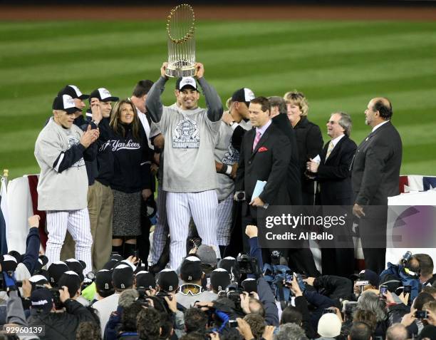 Andy Pettitte of the New York Yankees celebrates with the trophy after their 7-3 win against the Philadelphia Phillies in Game Six of the 2009 MLB...