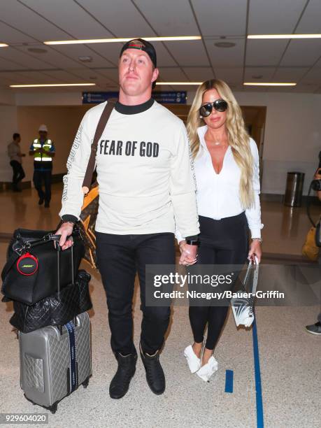 Kim Zolciak-Biermann and Kroy Biermann are seen at Los Angeles International Airport on March 08, 2018 in Los Angeles, California.