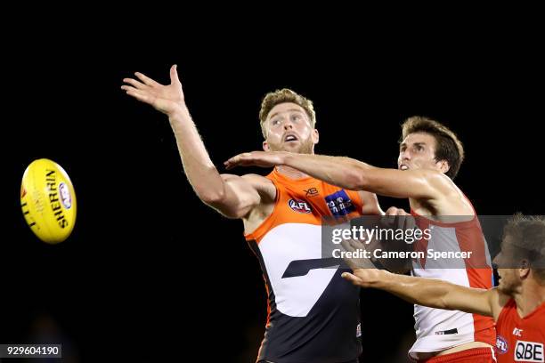 Dawson Simpson of the Giants taps the ball during the JLT Community Series AFL match between the Sydney Swans and the Greater Western Sydney Giants...