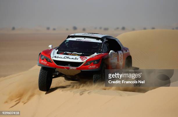 Sheikh Khalid Al Qassimi of UAE and Xavier Panseri of France and Peugeot 3008 DKR race during day one of the Dubai International Baja on March 9,...