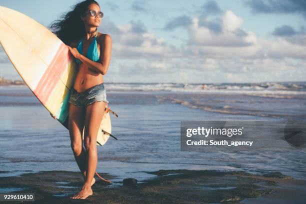 beautiful girl going surfing - asian swimsuit models stock pictures, royalty-free photos & images