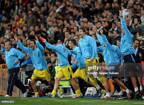 Alcorcon players jump off the bench celebrating after eliminating Real Madrid at the end of the Copa del Rey fourth round, second leg match between...