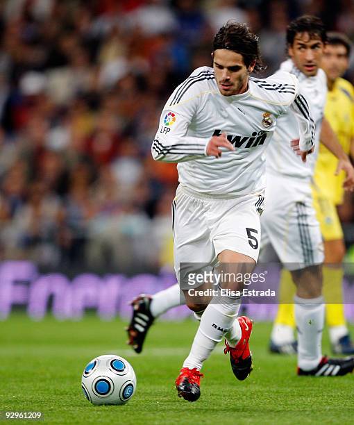 Fernando Gago of Real Madrid runs with the ball during the Copa del Rey match between Real Madrid and AD Alcorcon at Estadio Santiago Bernabeu on...
