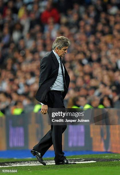 Coach Manuel Pellegrini of Real Madrid walks back to the bench during the Copa del Rey fourth round, second leg match between Real Madrid and AD...