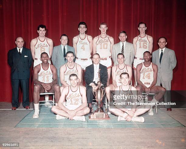 The World Champions of Basketball Syracuse Nationals pose for a team portrait front row : Dick Farley, Billy Kenville, Center Row: Earl Lloyd,...