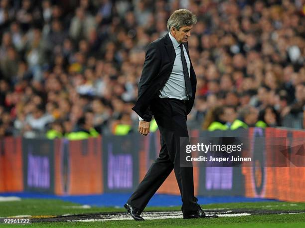 Coach Manuel Pellegrini of Real Madrid walks back to the bench during the Copa del Rey fourth round, second leg match between Real Madrid and AD...