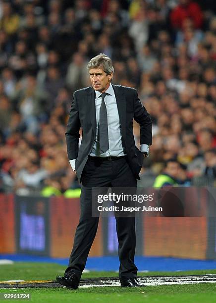 Coach Manuel Pellegrini of Real Madrid follows his players during the Copa del Rey fourth round, second leg match between Real Madrid and AD Alcorcon...