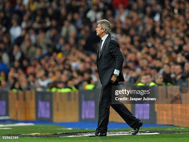 Coach Manuel Pellegrini of Real Madrid follows his players during the Copa del Rey fourth round, second leg match between Real Madrid and AD Alcorcon...