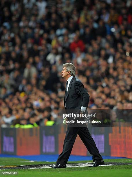 Coach Manuel Pellegrini of Real Madrid follows his players during the Copa del Rey fourth round, second leg match between Real Madrid and AD Alcorcon...