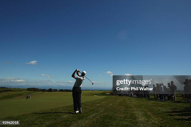Sean O'Hair of the USA plays an approach shot on the 4th hole during the first round of The Kiwi Challenge at Cape Kidnappers on November 11, 2009 in...