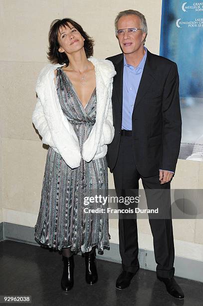 Actors Sophie Marceau and her companion Christopher Lambert attend the premiere of "L'Homme de chevet" at Cinematheque Francaise on November 9, 2009...