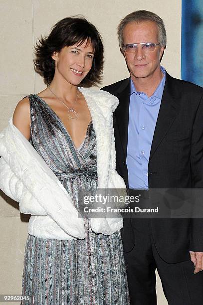 Actors Sophie Marceau and her companion Christopher Lambert attend the premiere of "L'Homme de chevet" at Cinematheque Francaise on November 9, 2009...