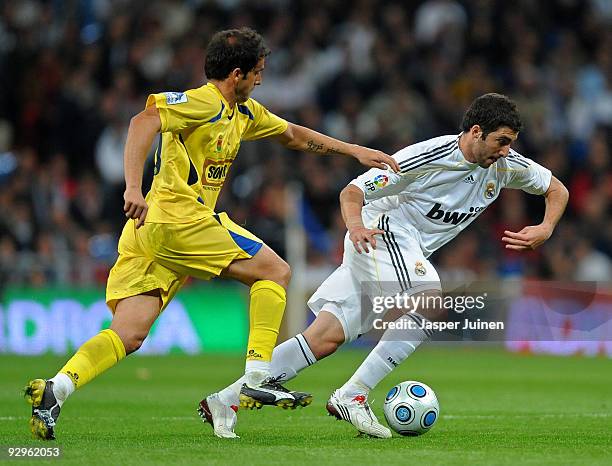 Sergio Mora of AD Alcorcon duels for the ball with Gonzalo Higuain of Real Madrid during the Copa del Rey fourth round, second leg match between Real...