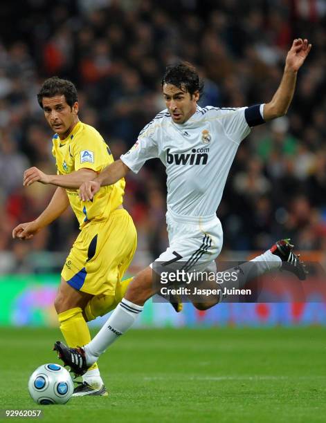 Raul Gonzalez of Real Madrid duels for the ball with Sergio Mora of AD Alcorcon during the Copa del Rey fourth round, second leg match between Real...