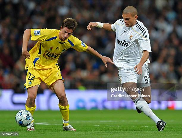 Borja Perez-Penas of AD Alcorcon duels for the ball with Pepe of Real Madrid during the Copa del Rey fourth round, second leg match between Real...