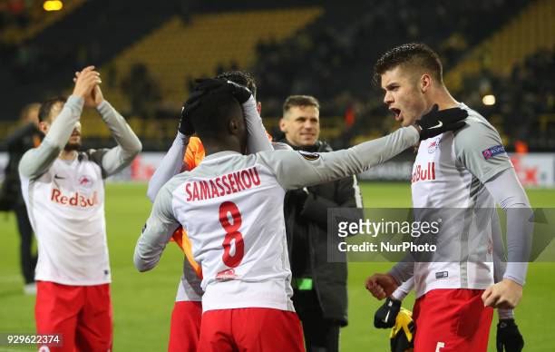 Diadie Samassekou and Duje Caleta-Car of Red Bull Salzburg celebrate victory after the UEFA Europa League Round of 16 match between Borussia Dortmund...