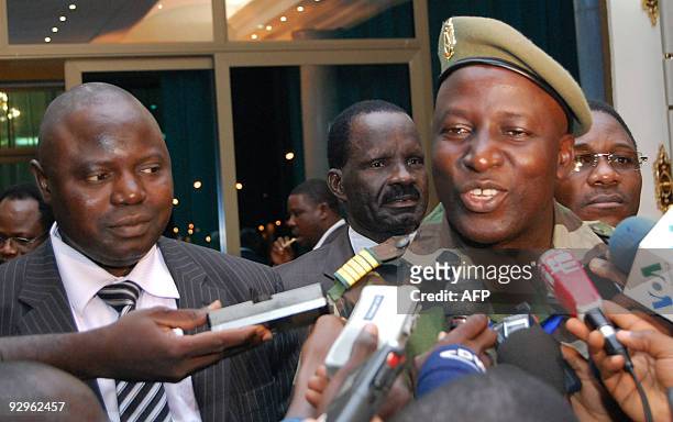 Guinea's ruling junta delegation leader colonel Moussa Keita answers media questions in Ouagadougou on November 10, 2009 after his meeting with...
