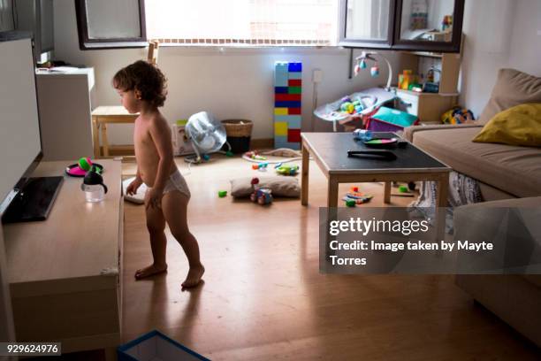 toddler making a mess at home - toddler mess stock-fotos und bilder