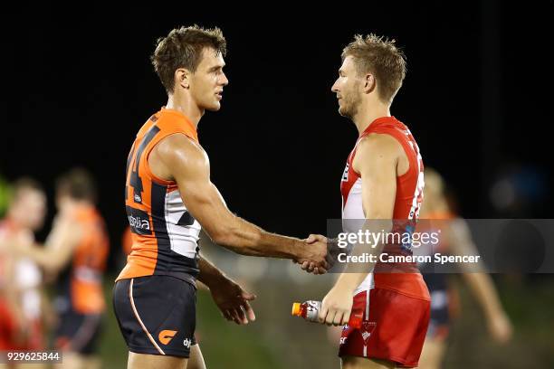 Matt de Boer of the Giants and Kieren Jack of the Swans shake hands following the JLT Community Series AFL match between the Sydney Swans and the...