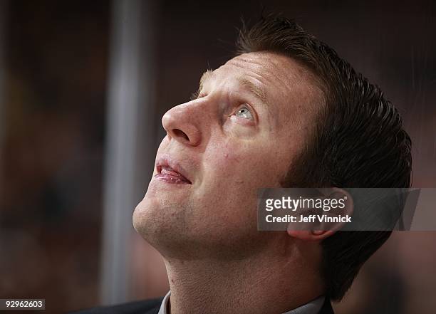 Head coach Joe Sacco of the Colorado Avalanche looks on from the bench during their game against the Vancouver Canucks at General Motors Place on...