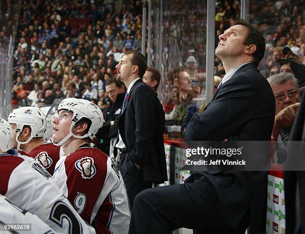 Head coach Joe Sacco of the Colorado Avalanche looks on from the bench during their game against the Vancouver Canucks at General Motors Place on...