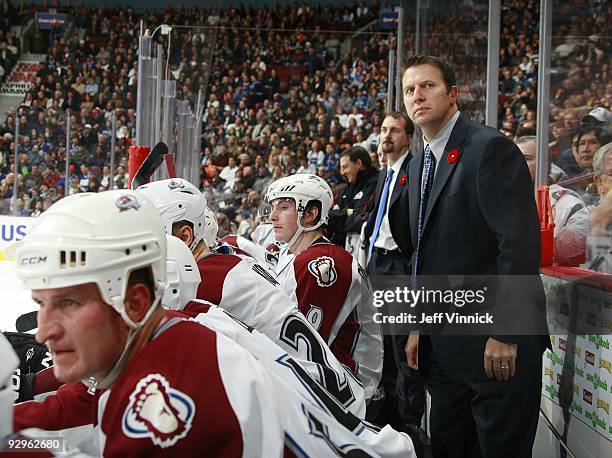 Head coach Joe Sacco of the Colorado Avalanche looks on from the bench during their game against the Vancouver Canucks at General Motors Place on...