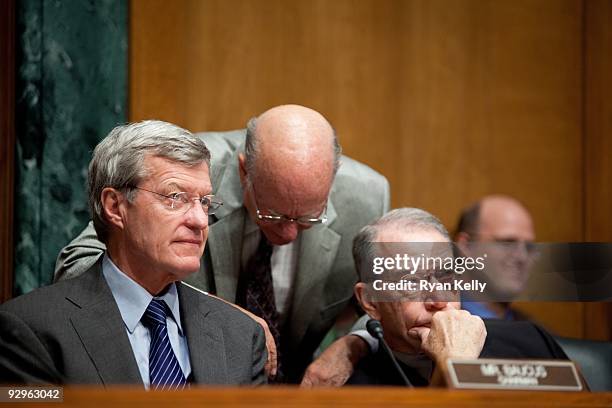 From left to right, Senators Max Baucus, D-Mont., Pat Roberts, R-Kan., and Charles E. Grassley, R-Iowa, at a Senate Finance Committee hearing on the...