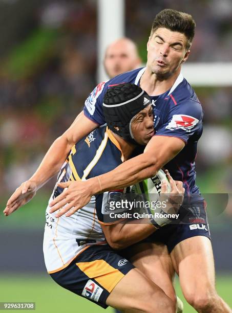 Christian Lealiifano of the Brumbies is tackled by Jack Maddocks of the Rebels during the round four Super Rugby match between the Rebels and the...