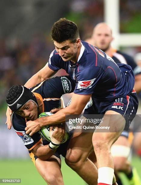 Christian Lealiifano of the Brumbies is tackled by Jack Maddocks of the Rebels during the round four Super Rugby match between the Rebels and the...