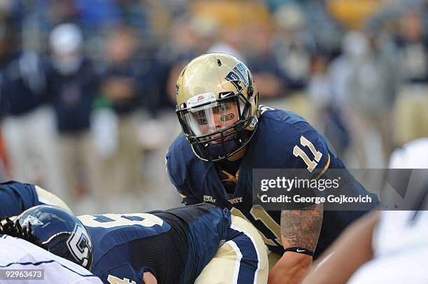 Quarterback Bill Stull of the University of Pittsburgh Panthers stands behind center during a college football game against the University of...