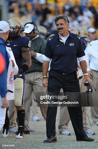 Head coach Dave Wannstedt of the University of Pittsburgh Panthers smiles as he looks on from the sideline during a college football game against the...