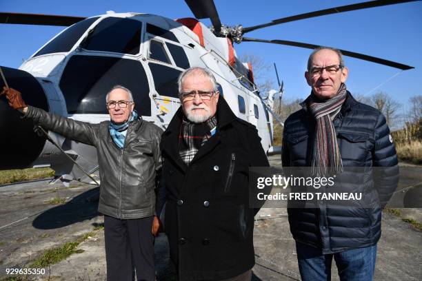 Former French navy personnel Yves Dagorn , Guy Le Nabat and Michel Le Gall pose on February 23, 2018 in Lanveoc-Poulmic, western France.