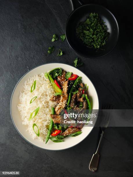 oriental beef stir fry with basmati rice - stir fried stock pictures, royalty-free photos & images