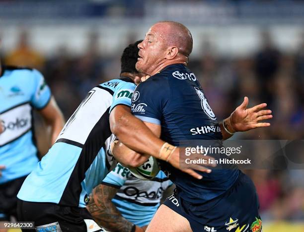 Matthew Scott of the Cowboys is tackled during the round one NRL match between the North Queensland Cowboys and the Cronulla Sharks at 1300SMILES...