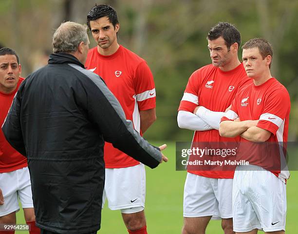 Ricki Herbert head coach of the All Whites discusses tactics with his team during a New Zealand All Whites training session at Endeavour Park on...