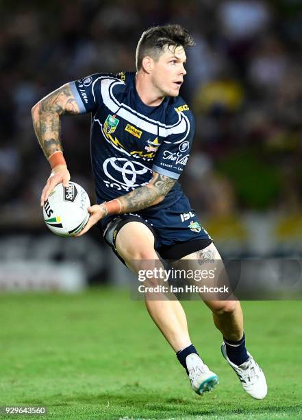 Ben Hampton of the Cowboys runs the ball during the round one NRL match between the North Queensland Cowboys and the Cronulla Sharks at 1300SMILES...