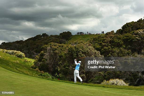 Anthony Kim of the USA plays an approach shot on the 16th hole during the first round of The Kiwi Challenge at Cape Kidnappers on November 11, 2009...
