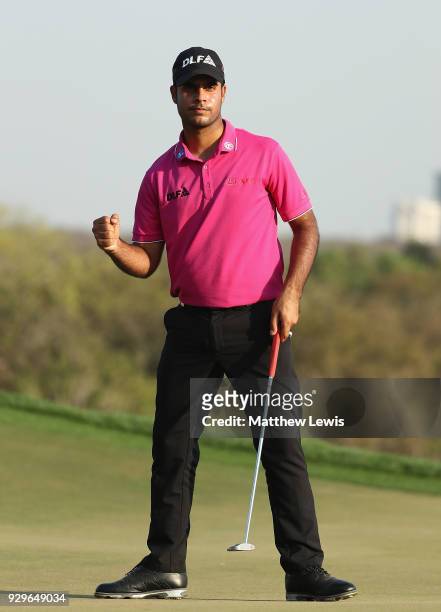 Shubhankar Sharma of India celebrates a birdie putt on the 17th green during day two of the Hero Indian Open at Dlf Golf and Country Club on March 9,...