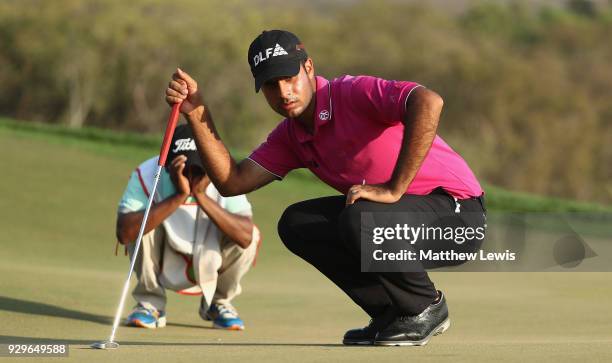 Shubhankar Sharma of India lines up a putt on the 17th green during day two of the Hero Indian Open at Dlf Golf and Country Club on March 9, 2018 in...