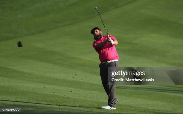 Andrew Johnston of England plays his third shot from the 15th fairway during day two of the Hero Indian Open at Dlf Golf and Country Club on March 9,...