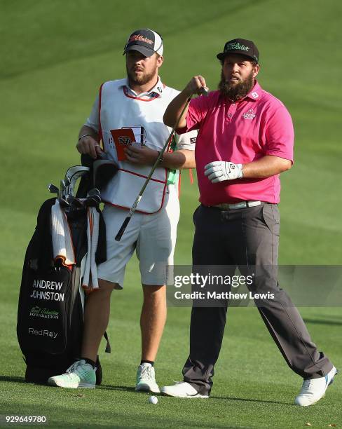 Andrew Johnston of England looks on with his caddie during day two of the Hero Indian Open at Dlf Golf and Country Club on March 9, 2018 in New...