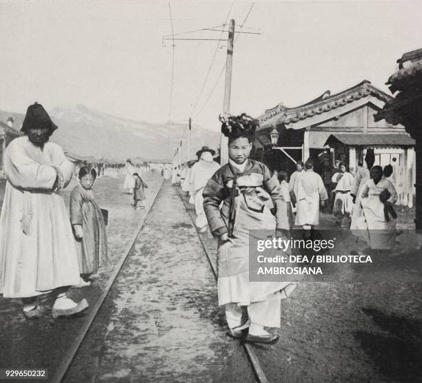 Bridesmaid getting to a wedding, Seoul, South Korea, from Le Figaro-Modes, No 24, December, 1904.